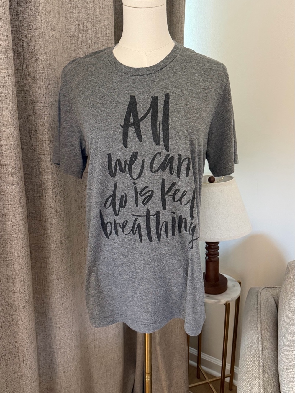 Bella Canvas Gray Graphic Tee "All We Can Do Is Keep Breathing"